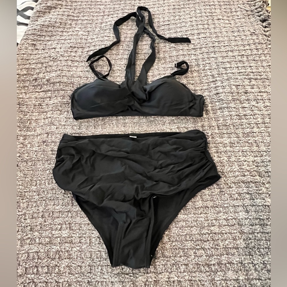 Black 2 piece. Liner in bottoms, never worn